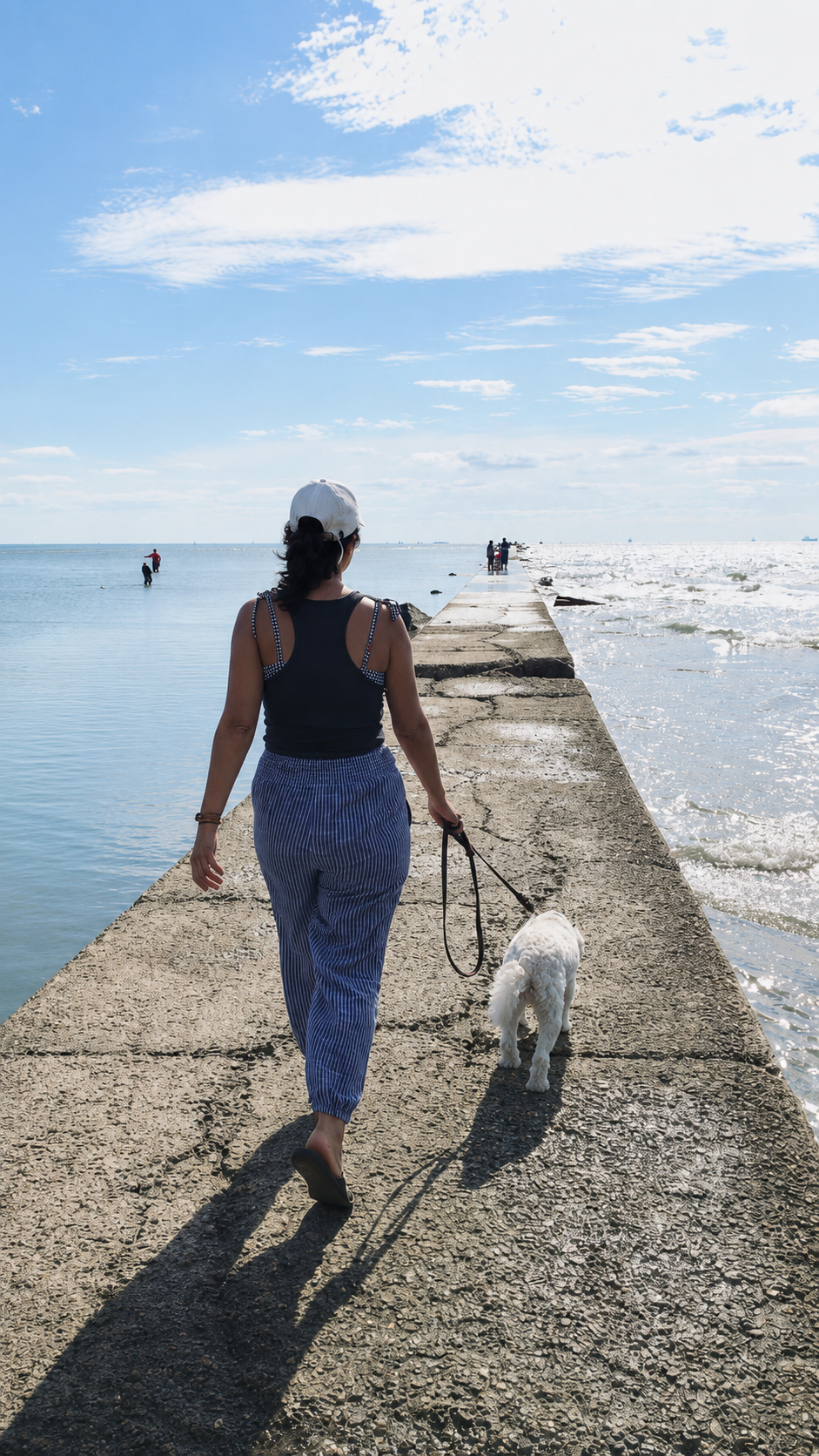 Irma walking her dog along the jetty