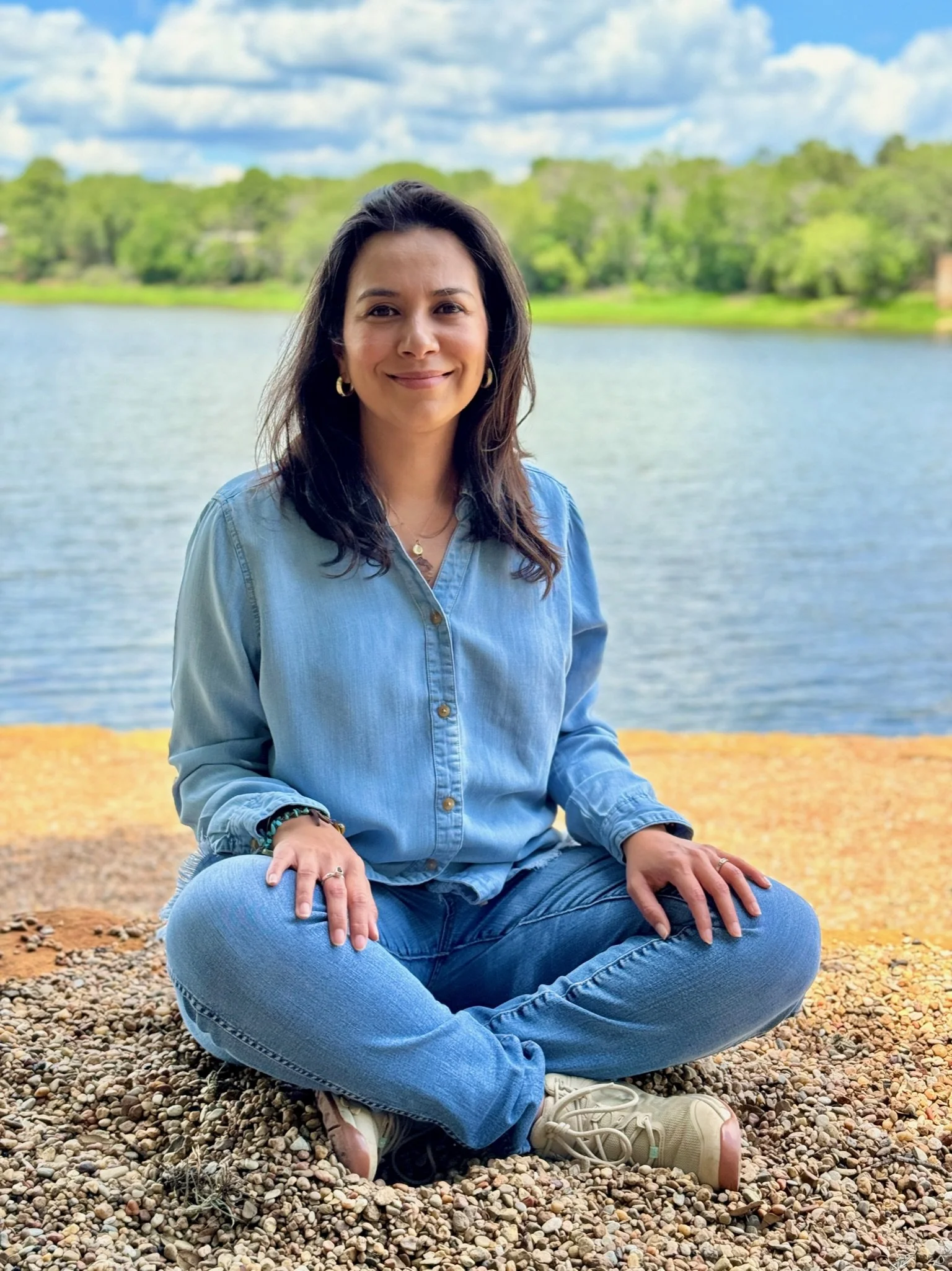 Irma seated lakeside