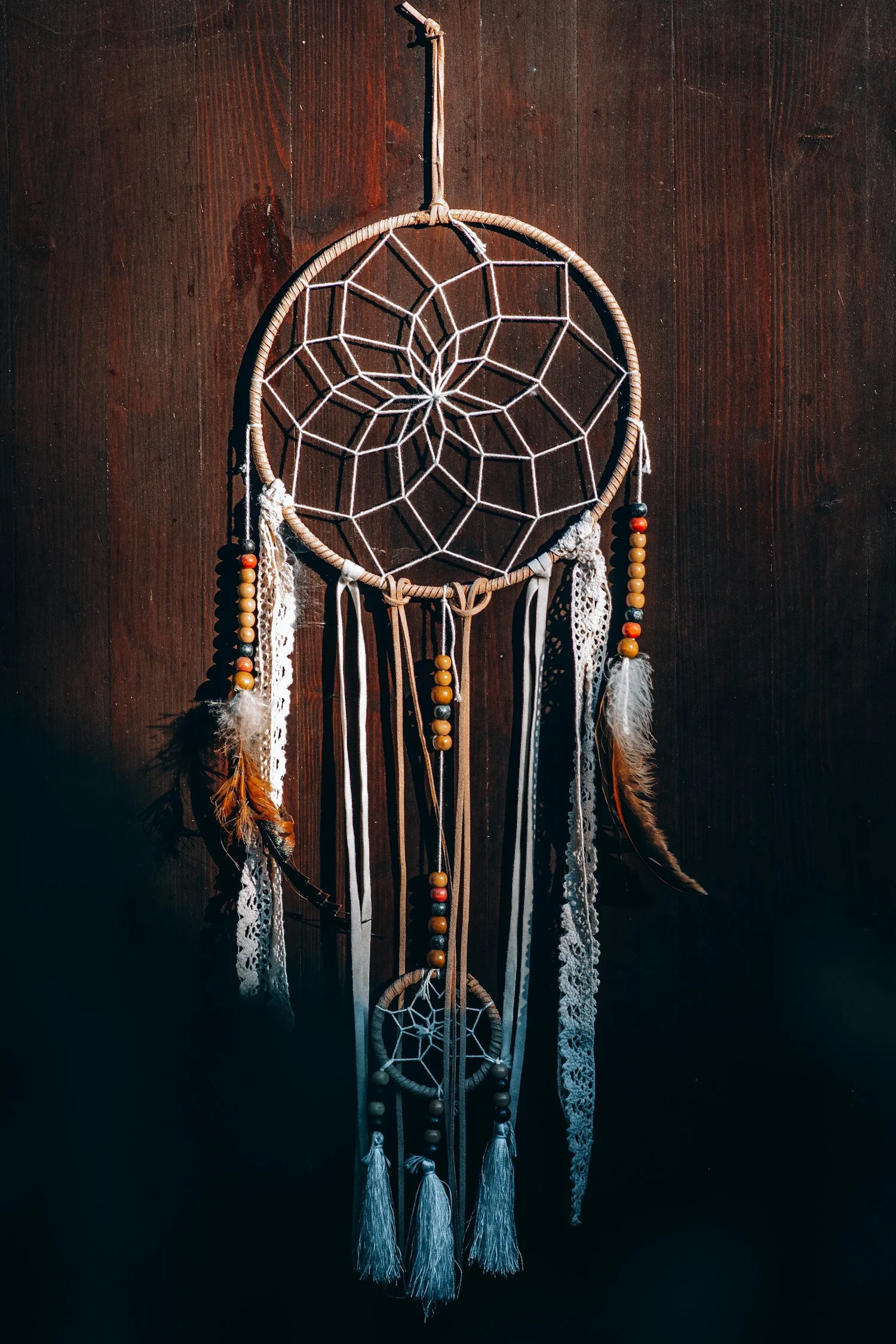 Dreamcatcher on dark wood